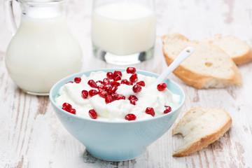 homemade yogurt with pomegranate, milk and bread