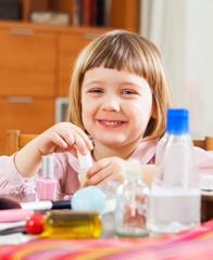  cute girl playing with makeup