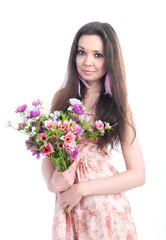 Beautiful girl with flowers on a white background