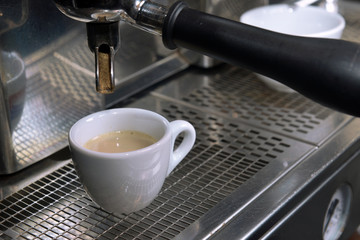 Espresso pouring into a cup