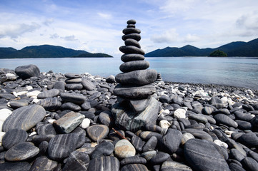 stach of stone on pebble beach
