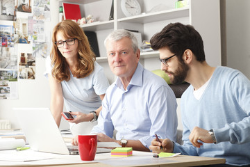 Business colleagues working on a laptop