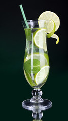 Glass of cocktail with lime and mint