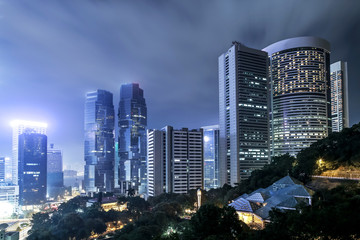 Naklejka premium modern buildings of the city at night