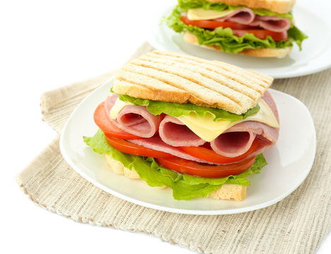 Tasty sandwiches with ham, isolated on white