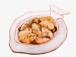 Seafood-mussels cooked with herbs on a white plate isolated