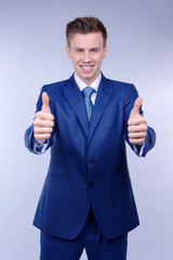 Business man on grey background