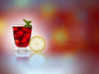 Fresh and cold ice tea with sliced lemon and mint