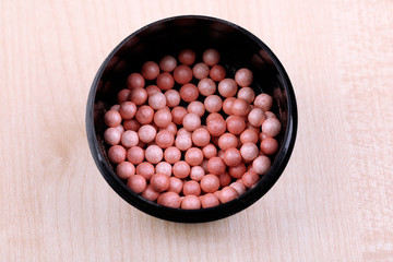 Powder balls on wooden background