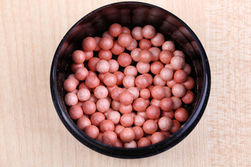 Powder balls on wooden background