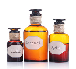 Historic old pharmacy bottles with label  isolated on white