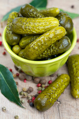 pickled cucumbers in a green bowl