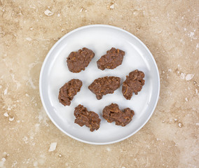 Milk chocolate cornflake clusters in dish