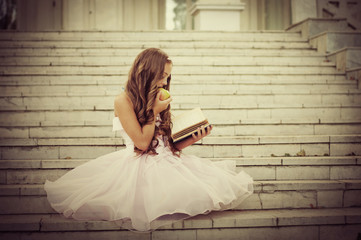 beautiful child reading a book