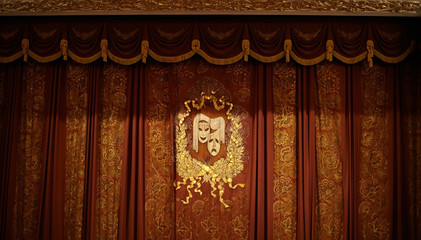 Theatrical mask on beautiful curtains