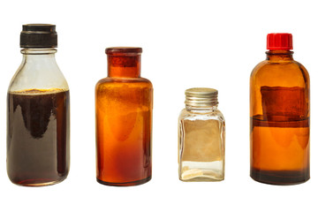 Four vintage medicine bottles isolated on white