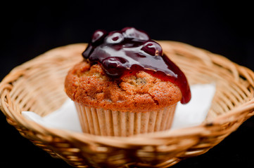 Blueberry cupcake on white background