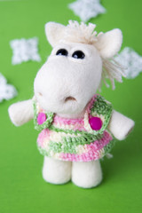 Toy white horse in a gift