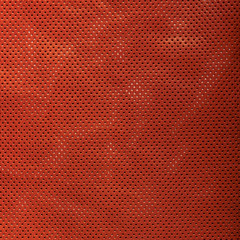 Perforated brown leather background