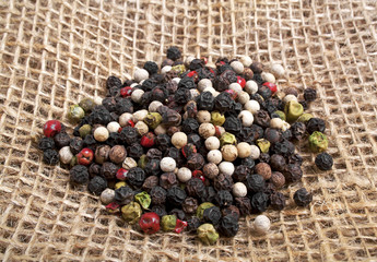 Colored peppers on burlap background