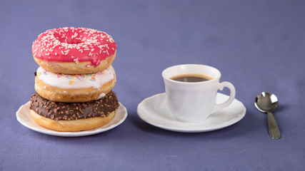 Cup of coffee with donuts
