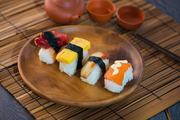 Salmon and caviar rolls served on a plate