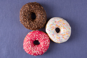 Donuts at the table with violet background