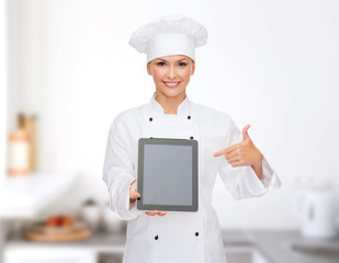 smiling female chef with tablet pc blank screen