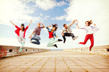 group of teenagers jumping