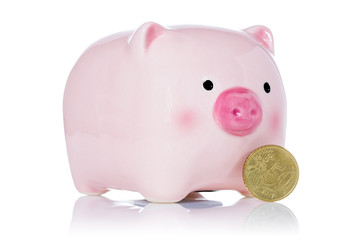 Pink piggy bank and fifty Euro cent