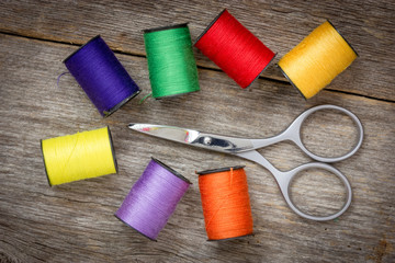 Scissors and spools of colored thread