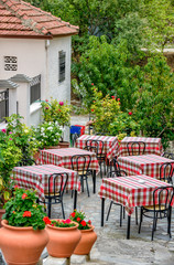Restaurant tables on street terrace