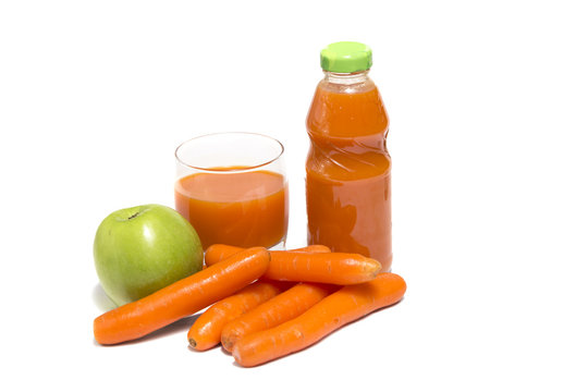 Apples, carrot and juice in glass