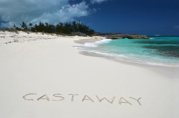Castaway writing on a desrt beach of Little Exuma, Bahamas