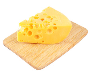Piece of cheese on wooden board, isolated on white