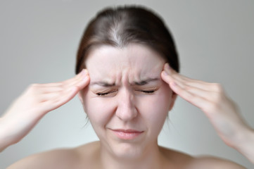 Fototapeta premium Young woman having headache