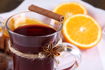 Mulled wine with oranges close up