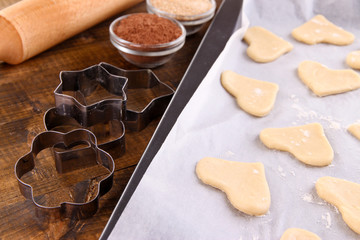 Making cookies on wooden background
