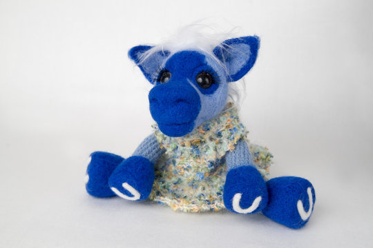 Toy blue horse in a gift