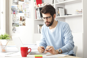Portrait of young modern businessman