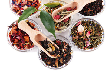 Aromatic dry tea in bowls close up