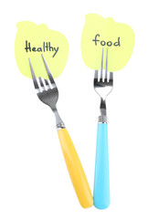 Note papers with messages attached to forks, isolated on white