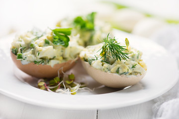 stuffed eggs with fresh herbs and mayonnaise - obrazy, fototapety, plakaty