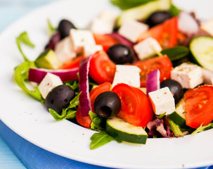 Greek salad on wooden background