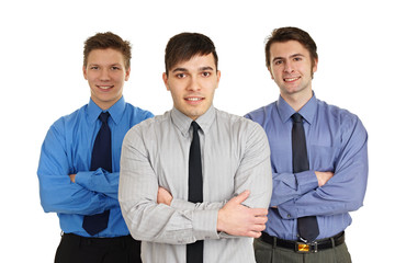 Portrait of three young business people standing