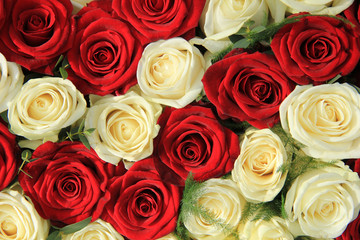 Red and white roses in a wedding arrangement