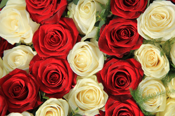 Red and white roses in a wedding arrangement