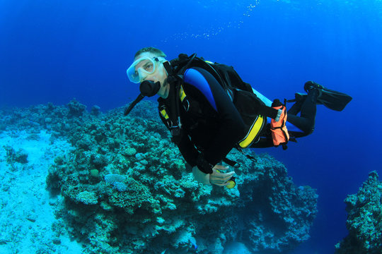 Scuba diver and coral reef underwater