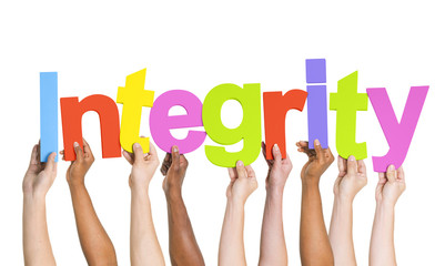 Multi-Ethnic Hands Holding The Word Integrity