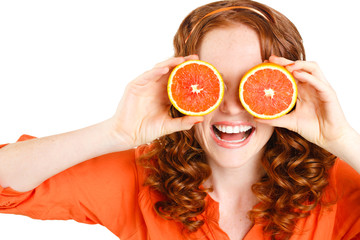 Portrait of a beautiful young woman with red hair oranges